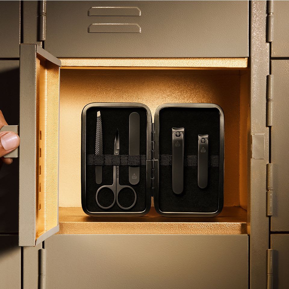 Close-up of The Shears 3.0 box while displaying all 5 nail grooming tools within the carrying case