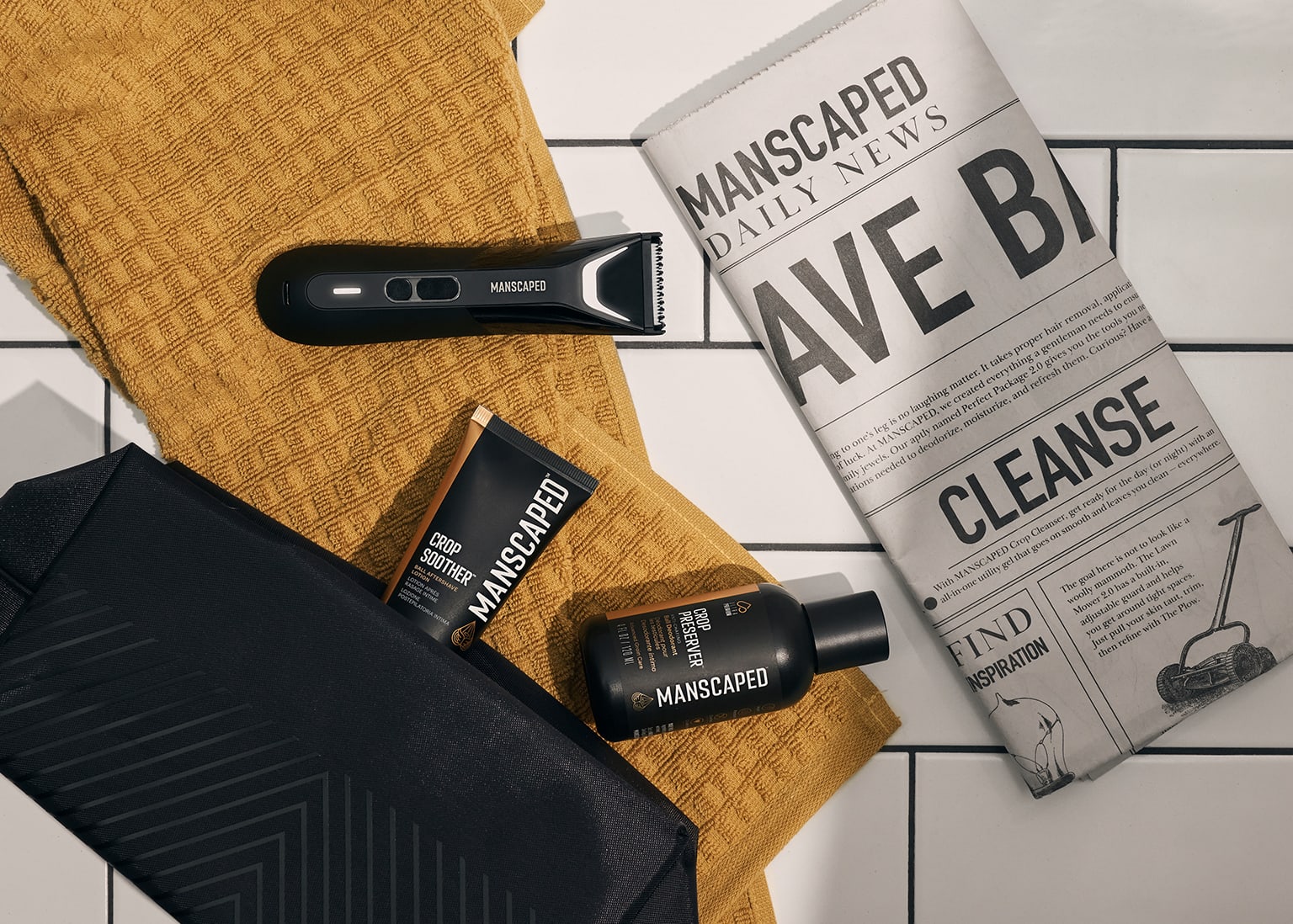 Collection of MANSCAPED products sitting on tile floor