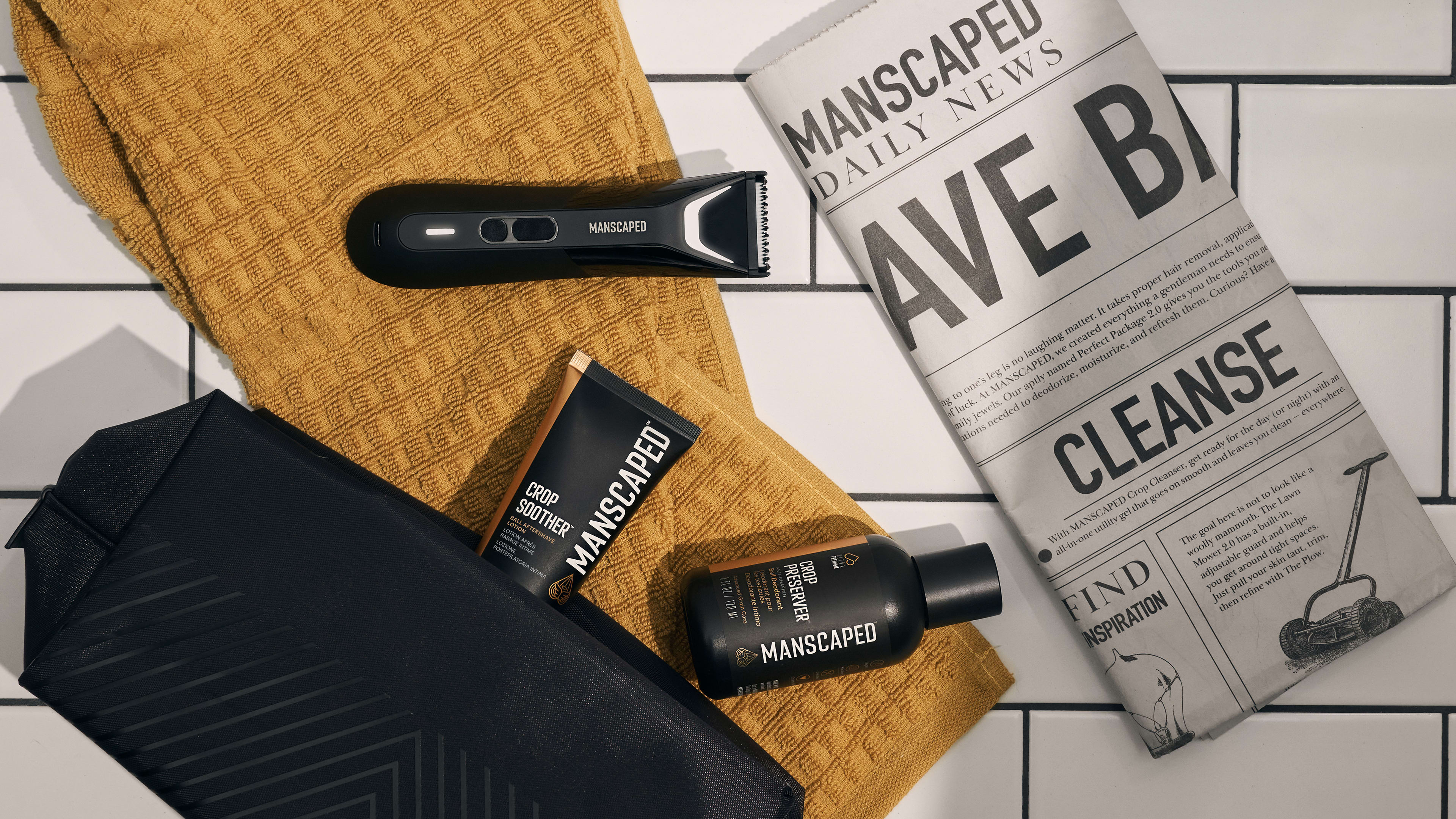 Collection of MANSCAPED products sitting on tile floor