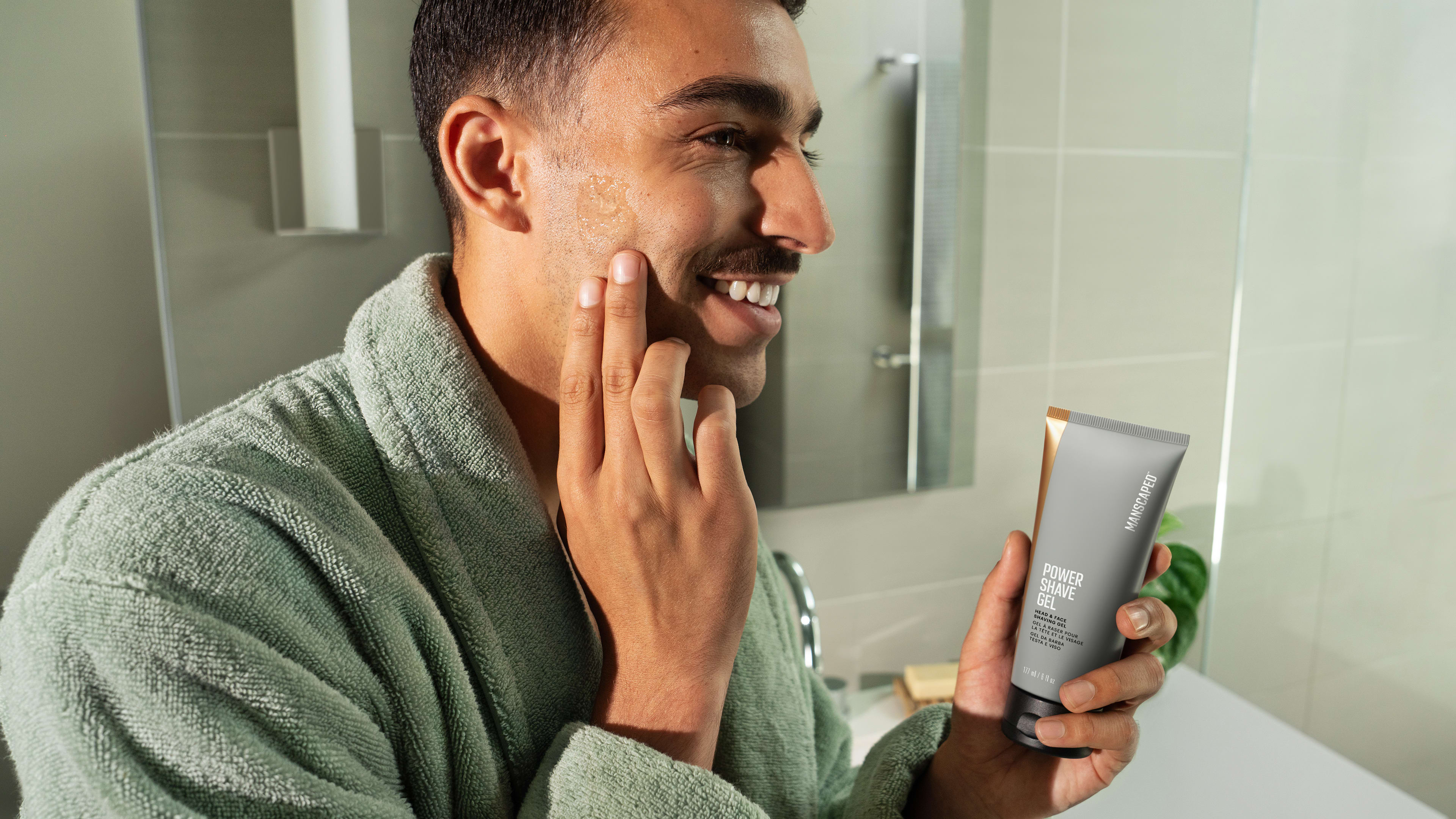 Male model applying Power Shave Gel in the bathroom